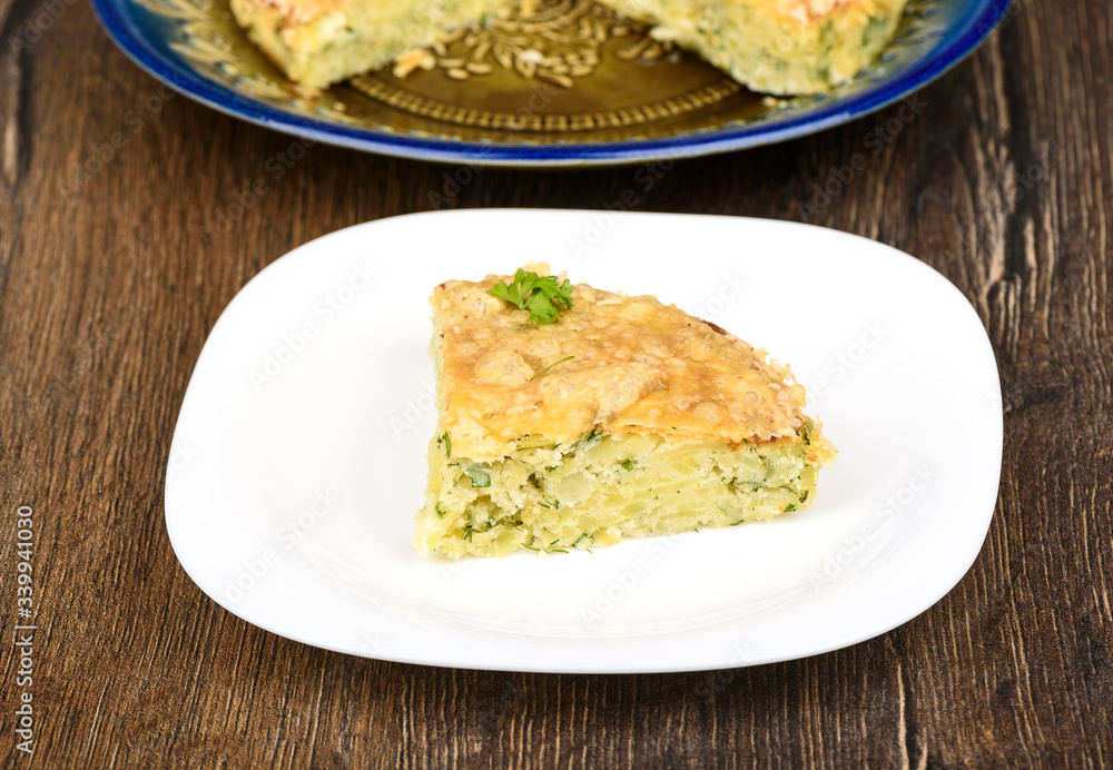 Slice of Turkish berek dish with cheese. Turkish national cuisine. Wood background. Slice of Turkish berek dish with cheese. Turkish national cuisine. Wood background.