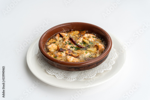 Shrimp Pil Pil with olive oil and garlic cooked in a clay pot dish