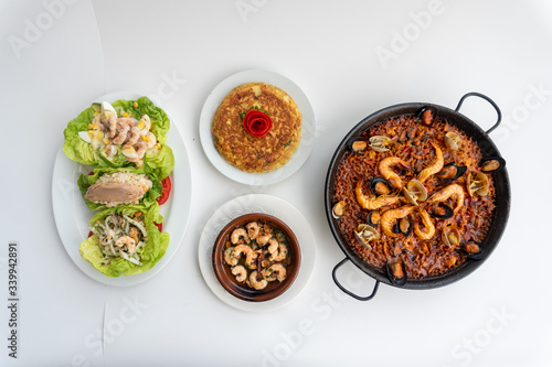 Spanish food together in one shot, paella, Tortilla espanola, Gambas Pil Pil, Ensalada de Pescado