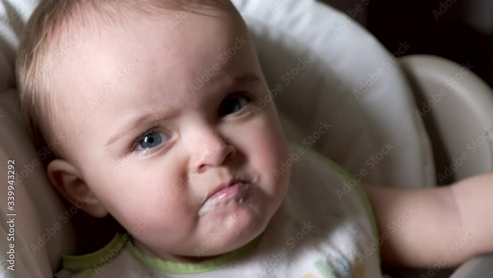Woman feeding child with spoon. Close-up. Woman feeding child with spoon. Close-up.