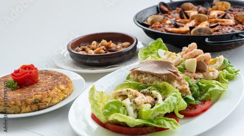 Spanish food together in one shot, paella, Tortilla espanola, Gambas Pil Pil, Ensalada de Pescado