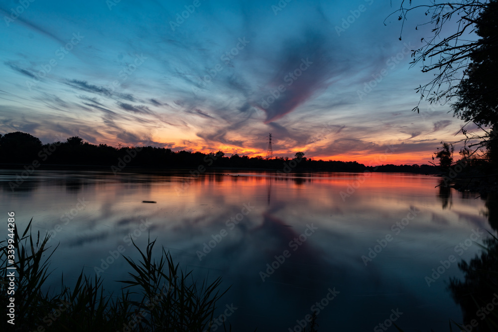 Sunset by a river