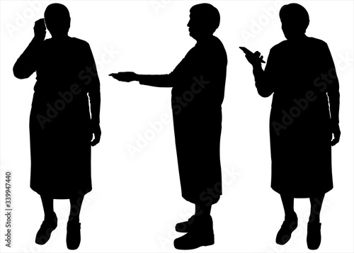 Vector illustration of group of old senior people using digital devices - talking, texting. Vector black silhouettes isolated on a white background. Grandma and the phone. Holds out the phone in hand.