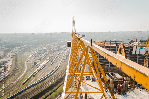 Construction. The jib of a tower crane on the background of the city.