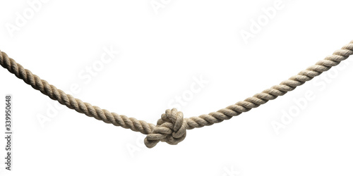 Large hanging rope with a knot in the center, isolated on a white background