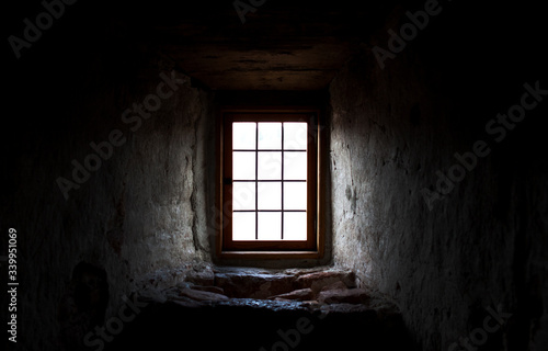 Old castle window in a dark corner