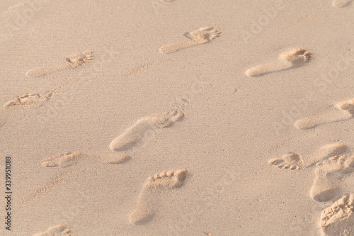 Footprints on wet sand on the beach, natural photo