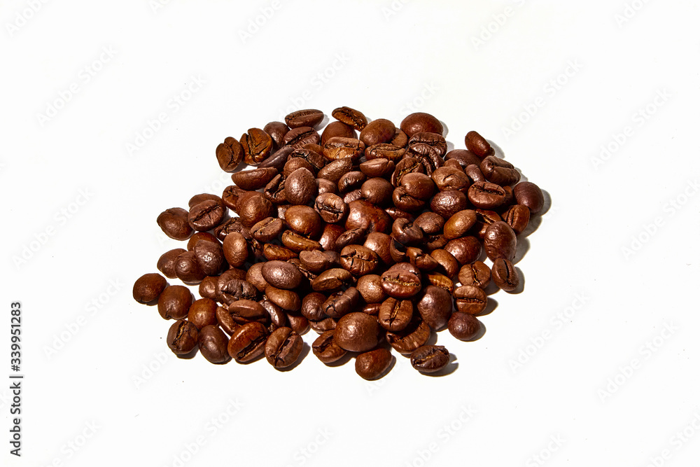 Arabica and Robusta coffee beans on a white background Arabica and Robusta coffee beans on a white background
