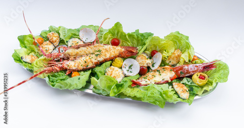 An assortment of baked seafood with cream and cheese