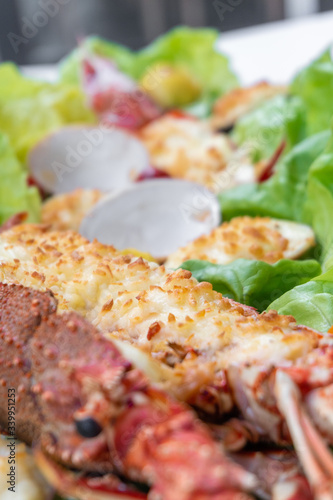 An assortment of baked seafood with cream and cheese