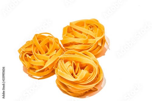 Italian pasta nests on a white background