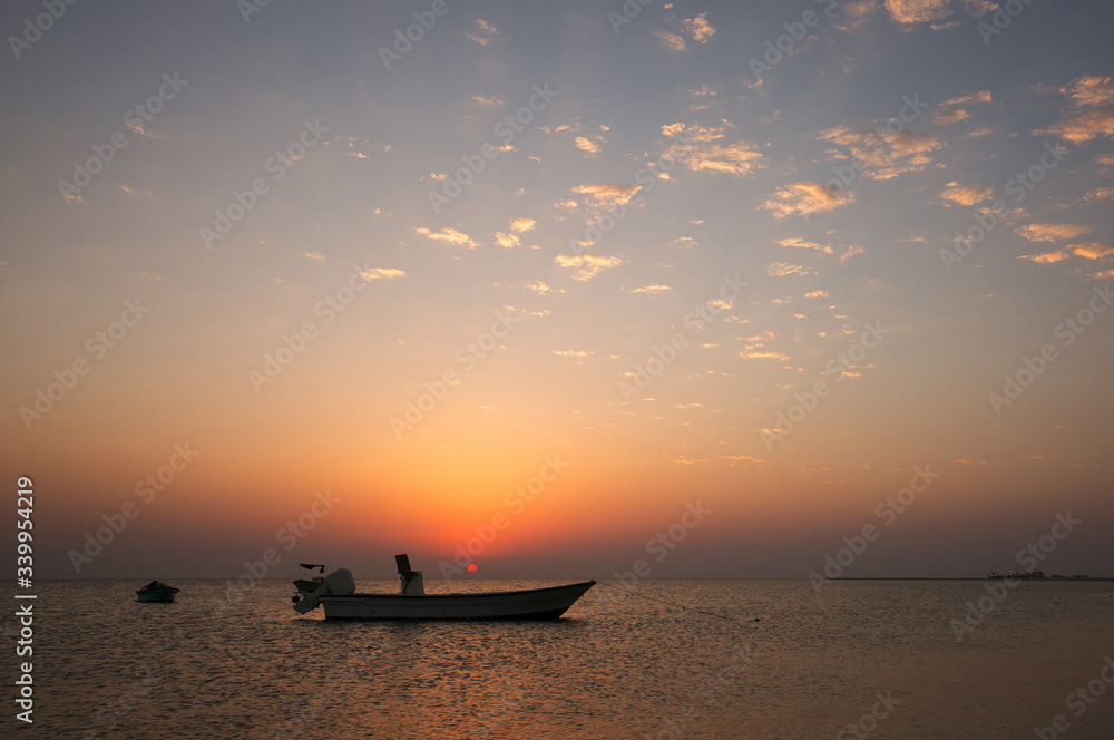 Speed boats during sunset at Busaiteen coast, Bahrain