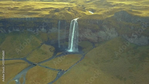 4K aerial footage of amazing waterfalls in South Iceland known as Seljalandsfoss Waterfall during summer season.