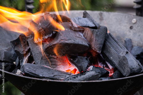 Fire burning in a fireplace. Charcoal and BBQ season.