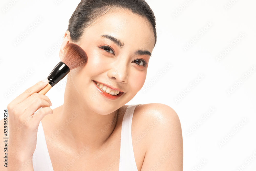 Beauty asian woman brown hair looking smile in camera happiness and hold make up brush and cheerful with make up brush,Beauty Concept on white background. Beauty asian woman brown hair looking smile in camera happiness and hold make up brush and cheerful with make up brush,Beauty Concept on white background.