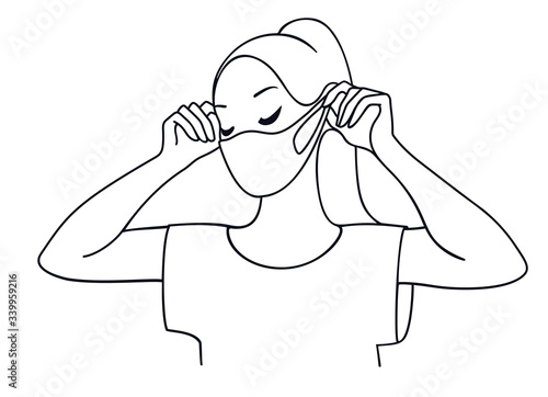 Wallpaper Mural A young woman putting on a medical face mask to protect herself from catching a virus, line art vector illustration. Torontodigital.ca