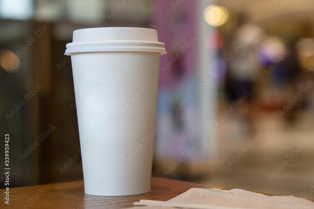 Mock-up of without Cup sleeve White paper hot coffee cup in Coffee shop./Food packaging pattern. Mock-up of without Cup sleeve White paper hot coffee cup in Coffee shop./Food packaging pattern.