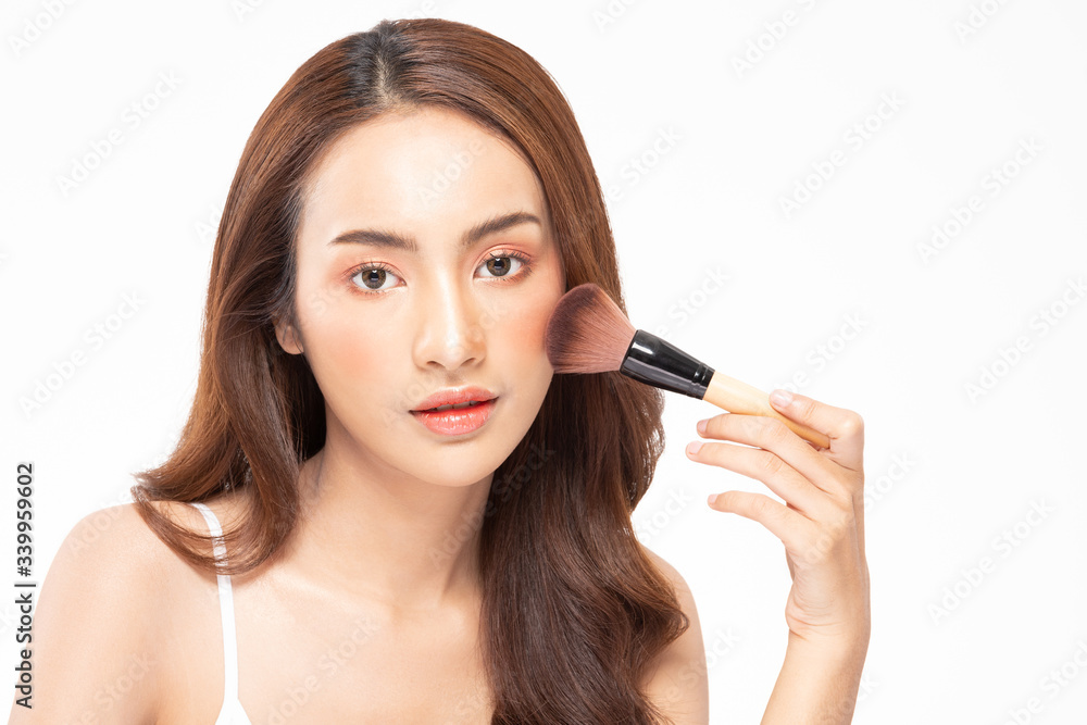 Beauty asian woman  brown hair looking smile in camera happiness and hold make up brush  and cheerful with make up brush,Beauty Concept on white background.
