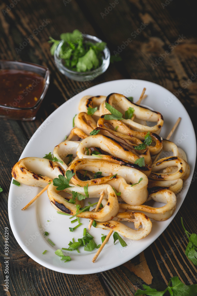 Grilled squid rings on a skewer