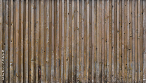Old boards, a wooden peeled wall of brown color