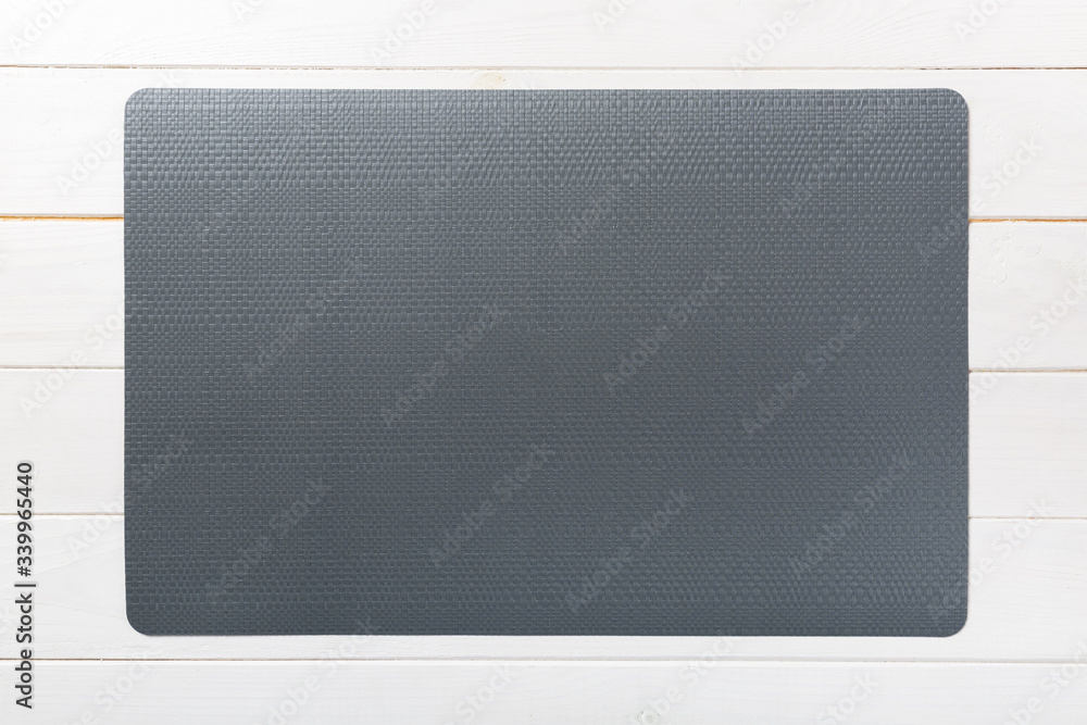 Top view of empty black table napkin for dinner on wooden background with copy space Top view of empty black table napkin for dinner on wooden background with copy space