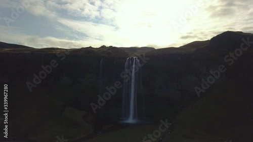 4K aerial footage of amazing waterfalls in South Iceland known as Seljalandsfoss Waterfall during summer season.