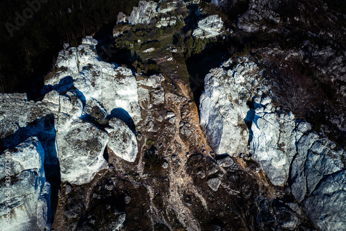 Top down view/ Aerial view over limestone rocks on the Mountain Kołoczek in Podlesice (Upland Cracow - Czestochowa, Wyzyna Krakowsko - Czestochowska), popular tourist place. During sunny early spring 