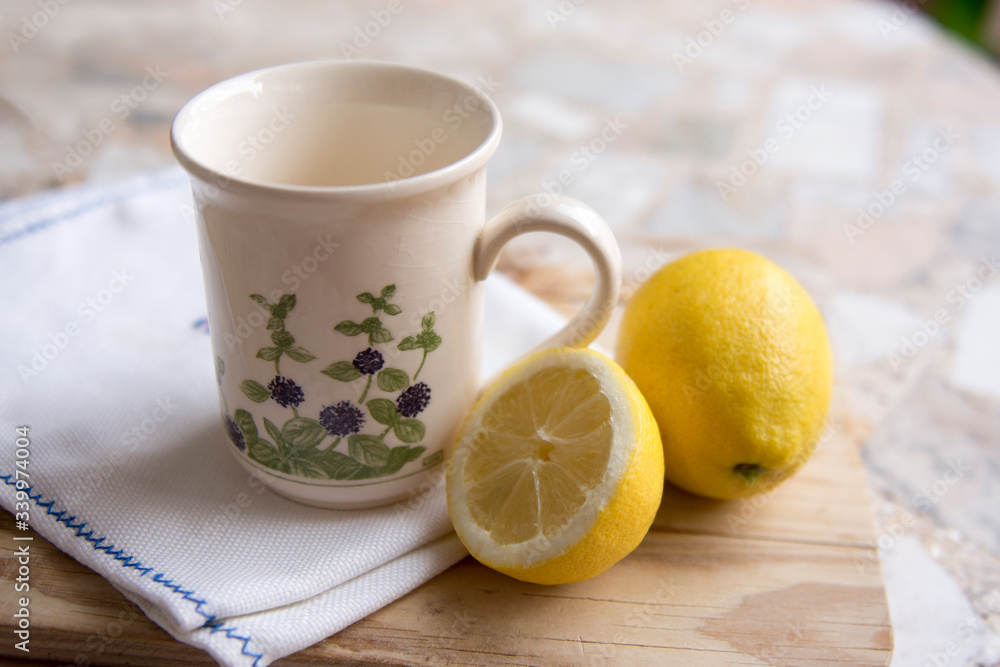 cup of chamomile tea with lemon on a neutral background cup of chamomile tea with lemon on a neutral background