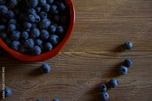 Red bown full of berries photo