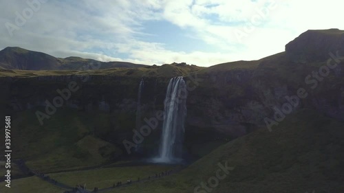4K aerial footage of amazing waterfalls in South Iceland known as Seljalandsfoss Waterfall during summer season.