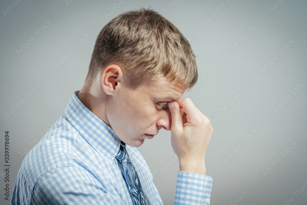 young casual man thinking young casual man thinking