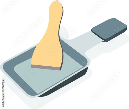Empty Raclette pan with wooden scraper