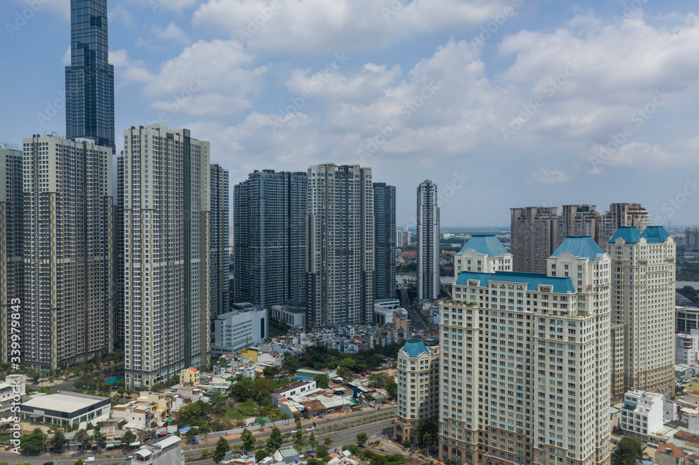 Fototapeta premium Aerial view of ultra modern high rise developments in Ho Chi Minh City, Vietnam, a bustling City in Southeast Asia