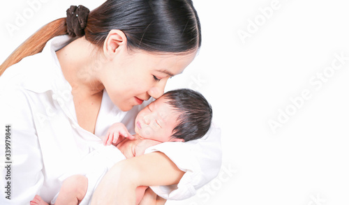 Mother day concept. The mother held the baby in her hand. Mom holding small baby. Woman hands holding newborn baby.