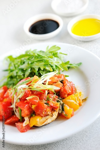 Tasty and beautiful tomato salad with French toast and sauce