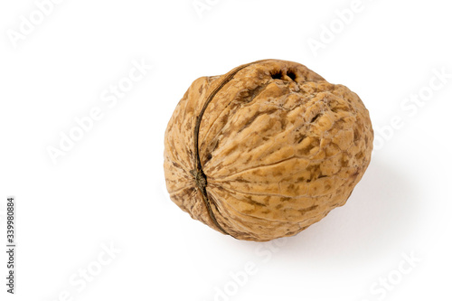 Ripe walnut isolated on a white background.