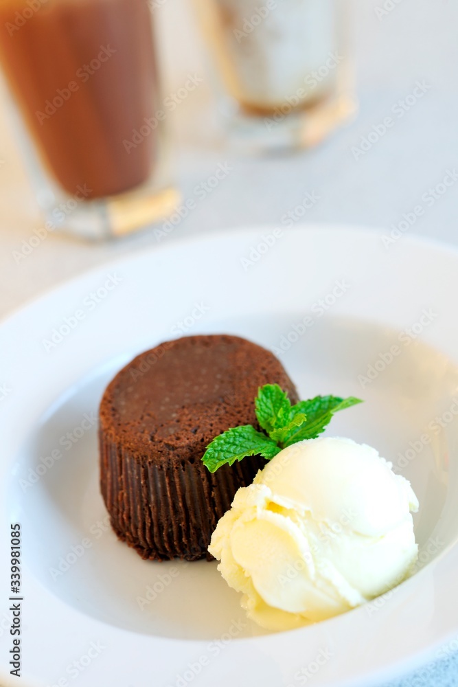 Beautiful tasty of chocolate Muffins with vanilla ice cream. Close up. Beautiful tasty of chocolate Muffins with vanilla ice cream. Close up.