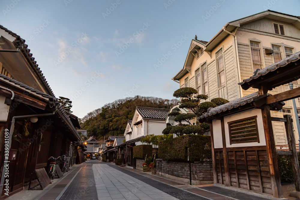 Takehara Townscape Conservation Area in dusk. The streets lined with old buildings from Edo, Meiji periods, a popular tourist attractions in Takehara city, Hiroshima Prefecture, Japan