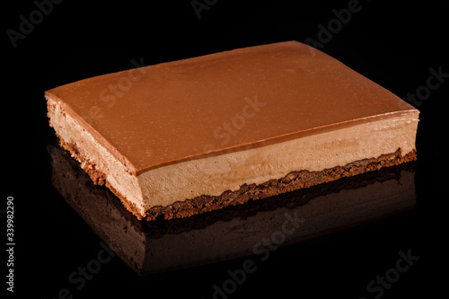 Chocolate and caramel Cheesecake. Art of sweets. Content for pastry shop and bakery. Traditional culinary.