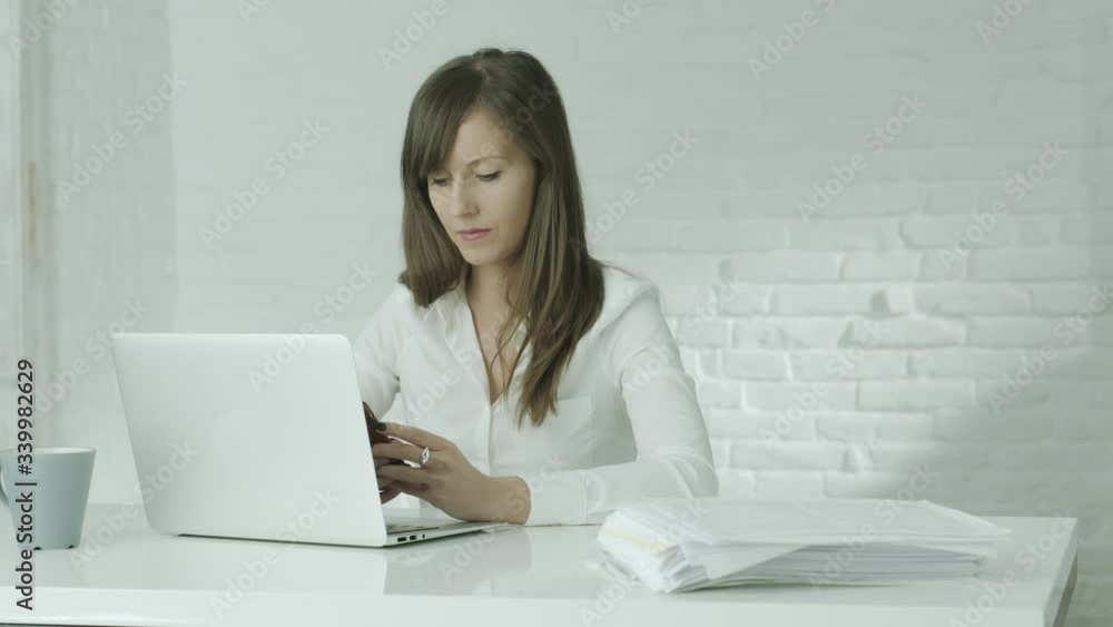 Business woman working with computer in office or from home office. White background with copy space. Business woman working with computer in office or from home office. White background with copy space.