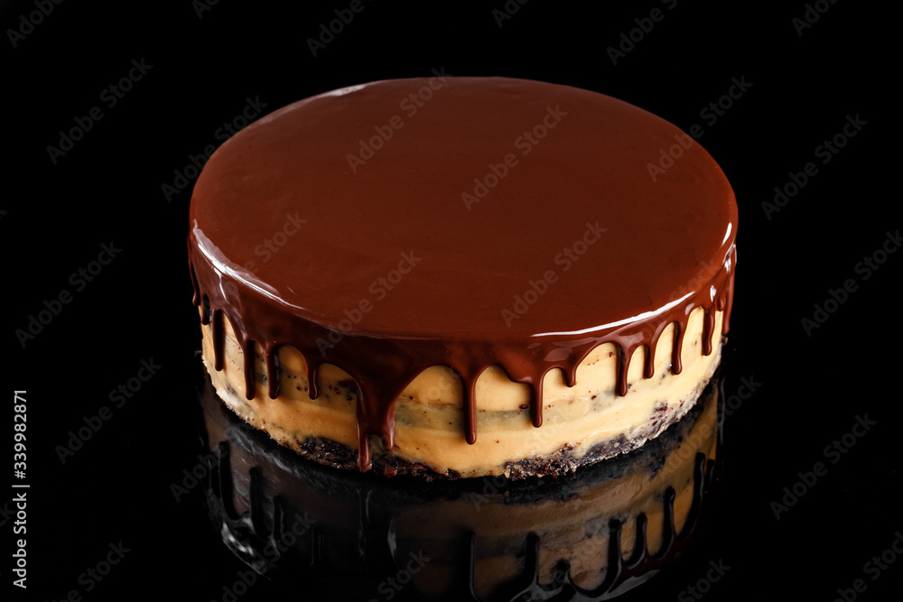 Triple layer chocolate moist cake with chocolate syrup on top. Confectionery photography concept. Triple layer chocolate moist cake with chocolate syrup on top. Confectionery photography concept.