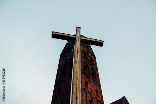 cross in the sky church blue sky 
