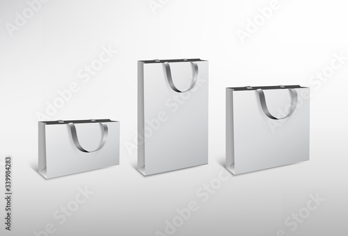 Set of white paper different size bags with silk rope. High resolution 3d illustration. Isolated on white background. 
