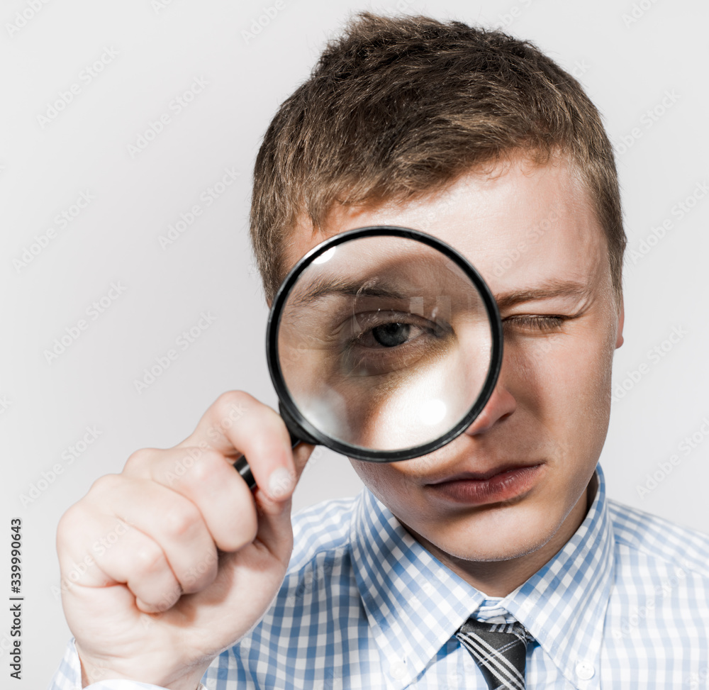 businessman with a magnifying glass businessman with a magnifying glass