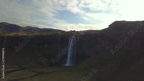 4K aerial footage of amazing waterfalls in South Iceland known as Seljalandsfoss Waterfall during summer season.