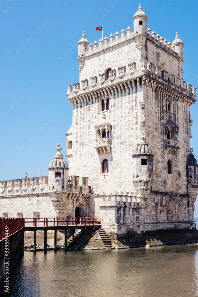 Naklejka premium Belem Tower on the Tagus River on a sunny day, Lisbon, Portugal