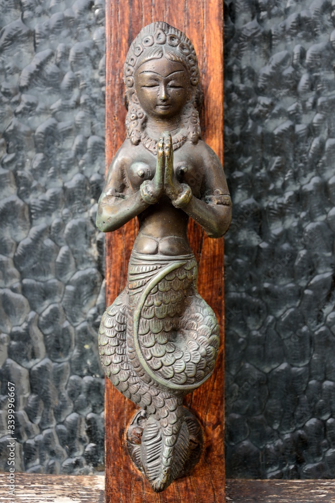 Bronze door handle in the form of Buddhist goddess with fishtail (Matsya), with her hands in Anjali Mudra in San Marino