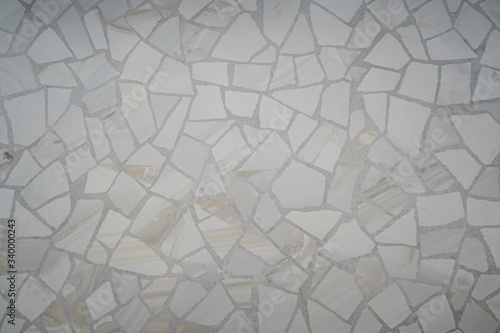 white mosaic of fragments of stone for decorative design of walls