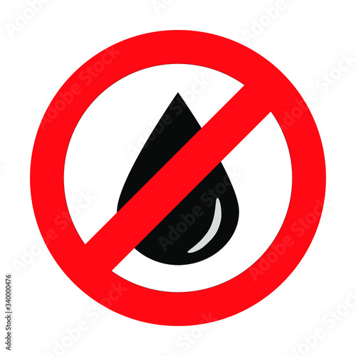 Isolated black oil drop or drip in forbidding crossed out red circle on white background. The sign or simbol of reducing or prohibition of oil production or oil extraction