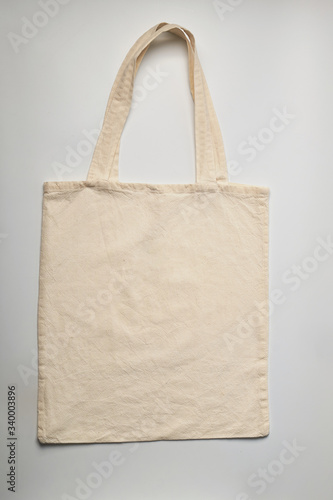 White cotton bag. Studio shot isolated on a white background, textile bag.